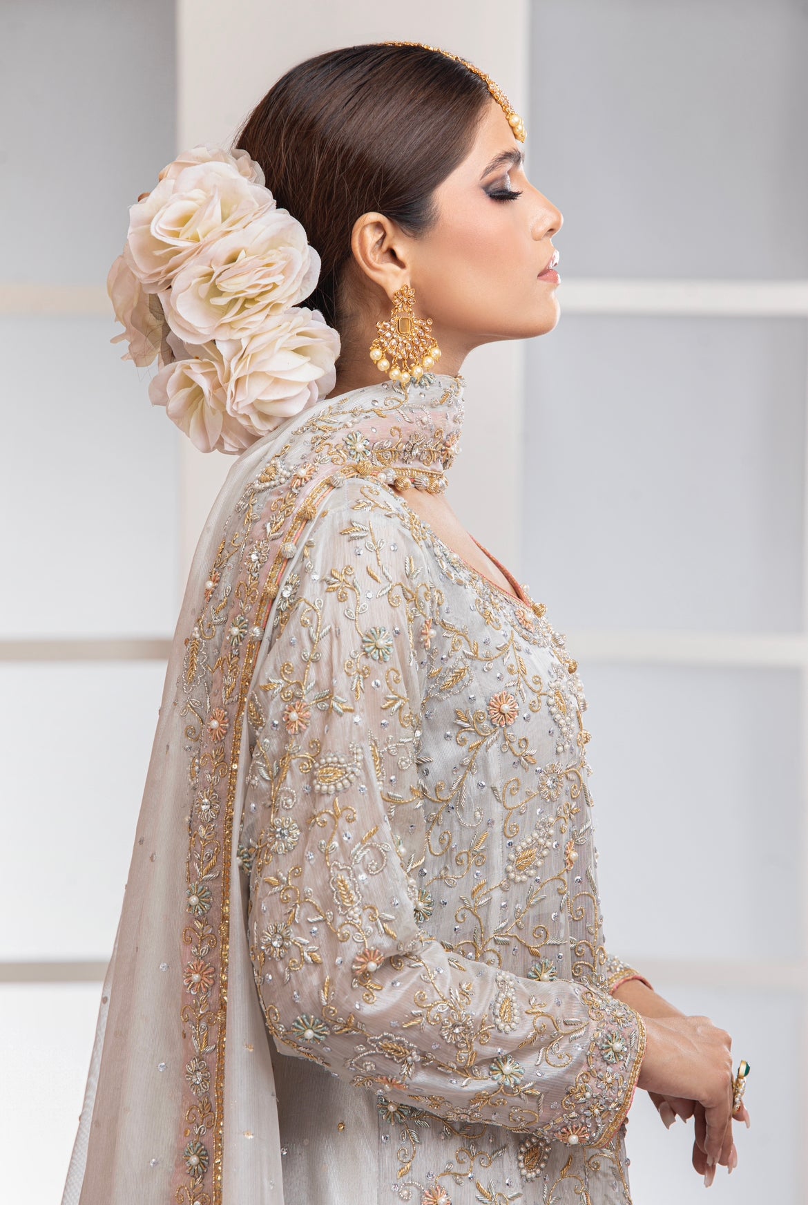 silver pakistani wedding dress Delicately crafted white and silver bridal look. The 3 part set takes inspiration from French florets over a soft cotton colored net canvas. Lehenga comes lined with silver and white jacquard. #Netfabricbridal #